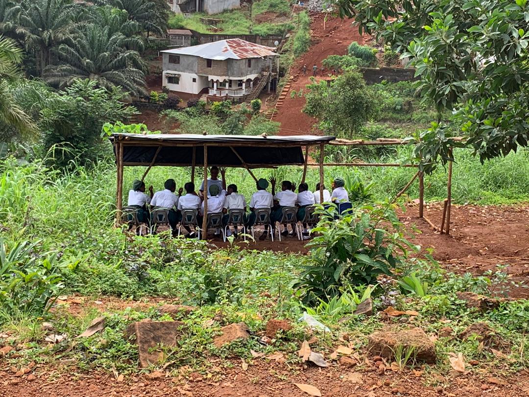 October 2019 - Regent Village has an urgent need for a larger Junior Secondary School and a new  Senior Secondary School.  This photo shows children being taught outdoors because of lack of space at the Junior Secondary School.